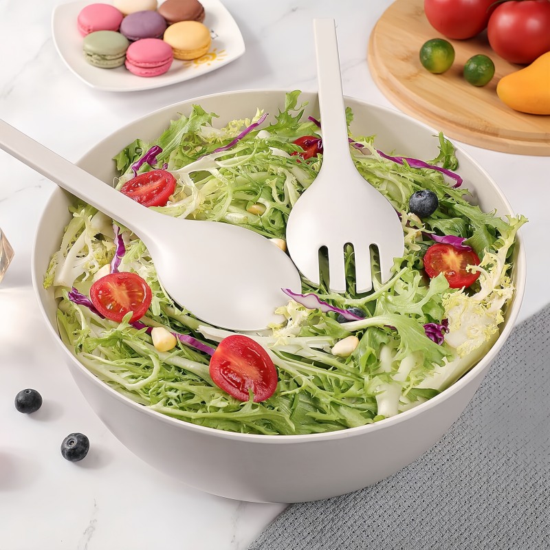 white salad bowl with servers